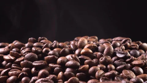 Close-up of roasted coffee on a black background Stock Footage 122852883