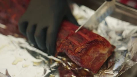Close up of roasted meat being sliced with a knife Stock Footage 339768870