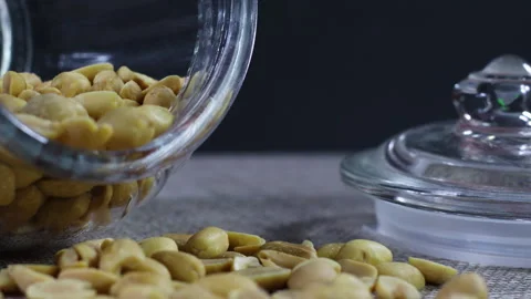 Close up of roasted peanuts in glass jar on the table 動画素材 140230845