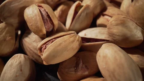 Close up of roasted pistachios with shells cracked open revealing nutritiou.. Stock Footage 337356841