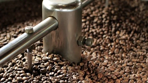 Close up Roasting machine Roasting coffee beans Video stock 128020541