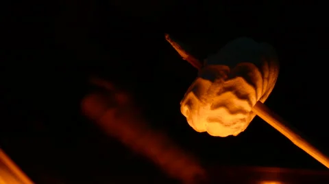 Close up roasting marshmallow on fire. Stock Footage 68979354