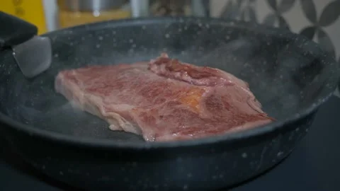 Close up on a roasting rib steak Stock Footage 138900667
