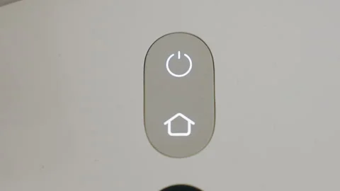 Close Up of Robot Vacuum Control Panel with Illuminated Power and Home Button Video stock 320018430