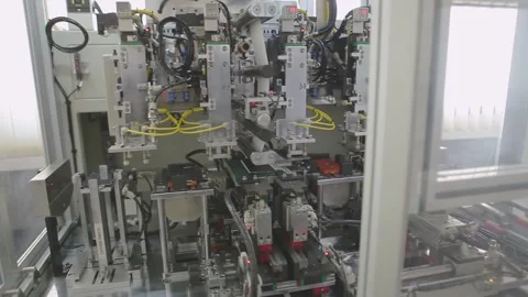 Close-up of Robotic Assembly Machinery for Lithium Battery Production Stock Footage 336610098