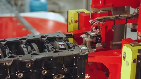 Close-up of a robotic car motor assembly line, an automated factory Stock Footage 318527810