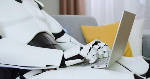 Close up of robotic hands typing on wireless laptop at home. Concept of Stock Footage 244136681