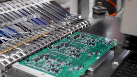 Close-up of a robotic machine assembling electronic components Stock Footage 314908084