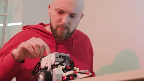 Close up of a robotics teacher hands, online course for his students using a Video stock 152845685