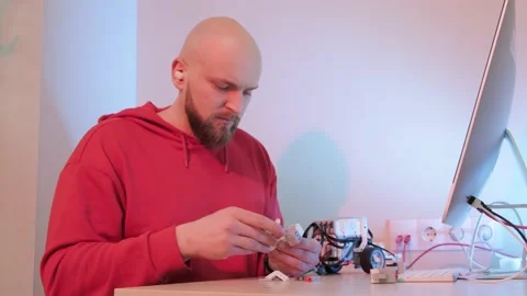 Close up of a robotics teacher hands, online course for his students using a Video stock 153109385