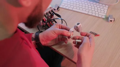 Close up of a robotics teacher hands, online course for his students using a Stock Footage 165294580