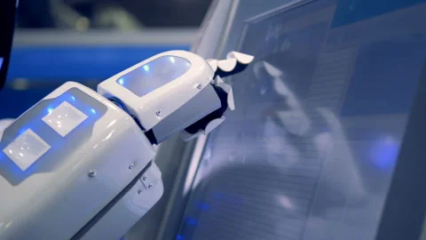 Close up of robot's bionic hand changing settings on a touchscreen Stock Footage 90906640