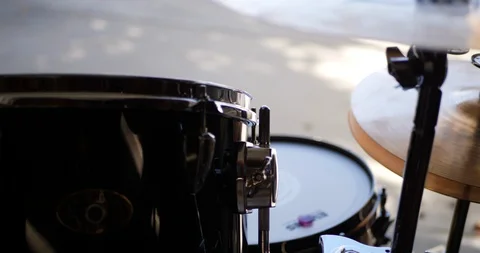 Close up on a rock and roll drum set with tom, snare and cymbal hi hat in Stock Footage 124228391