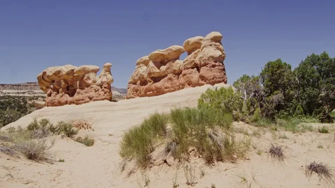 A close up of a rock with Devil's Garden in the background Stock Footage 128837014