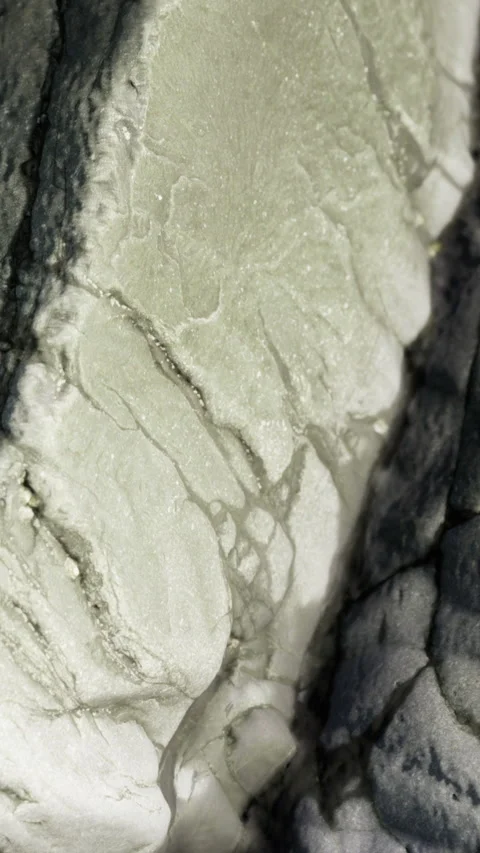 Close up of rock surface showing patterns and textures found in nature Stock Footage 336180685