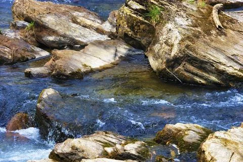 Close up of Rocks in a flowing River Stock Photos