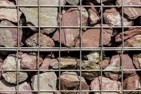 Close up of rocks in a metal cage Stock Photos