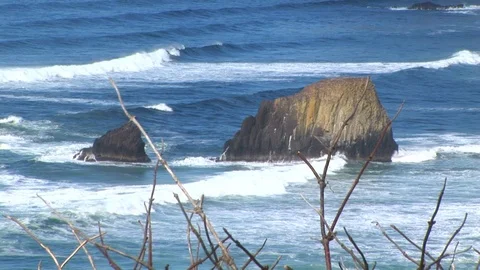 Close up of rocks in Pacific Ocean at Cannon Beach, Oregon USA Stock Footage 102188664