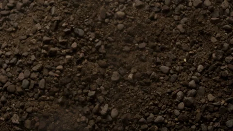 Close up of Rocks Rolling Around as the Ground Rumbles and Shakes Stock Footage 270409956