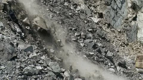 Close-up of rocks tumbling in mining landslide Stock Footage 12179638