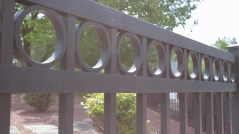 Close up rod iron gate summer Stock Footage 107944502