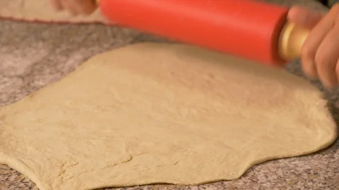 Close up - roll out the dough to prepare Italian pizza Stock Footage 95239840