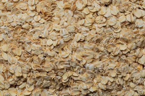 A close-up of rolled oats as a solid background for food, porridge cooking, i Stock Photos