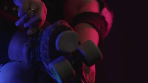 Close up roller derby chick putting skates on Stock Footage 233820661