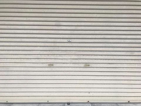 Close up Roller shutter doors. / grey background. Stock Photos