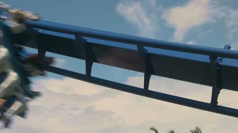 Close-up Rollercoaster Speeding By with People Screaming Stock Footage 21991952