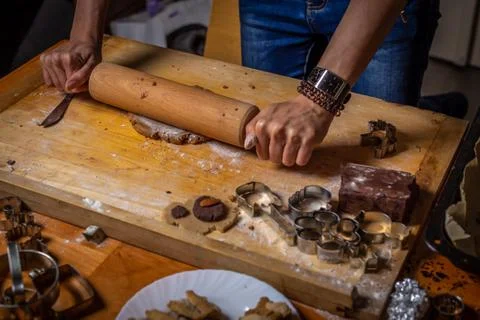Close up on rolling gingerbread dough with forms, cutters and ingredients Stock Photos