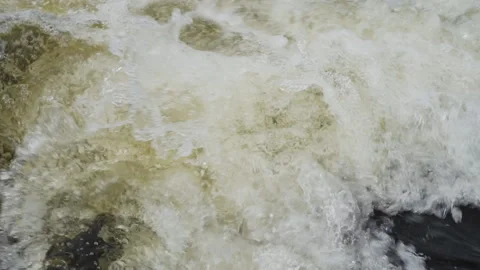 Close-up Rolling mountain river with seething water. Slow motion Stock Footage 136030279