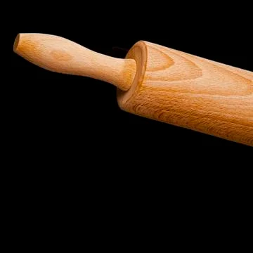 Close up of rolling pin on black background Stock Photos