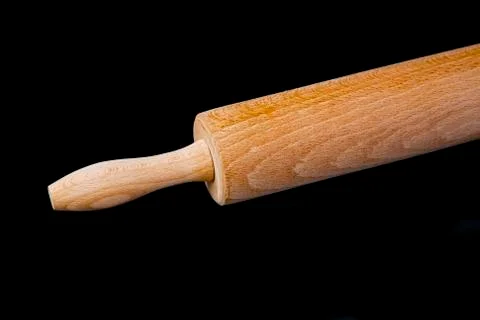 Close up of rolling pin on black background Stock Photos