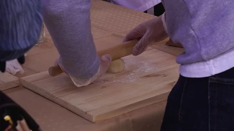 Close-up rolling pin roll out the dough Stock Footage 119941277