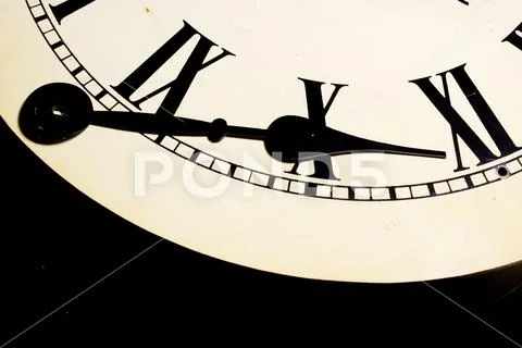 Close Up Of Roman Numeral Clock Face And Cogs Stock Photos
