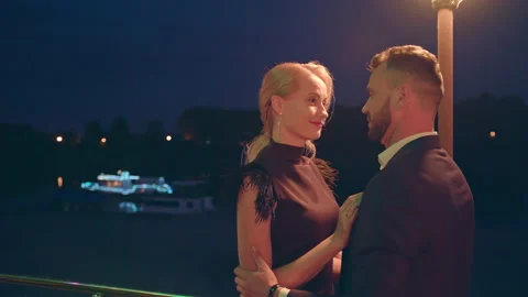 Close up of romantic couple looking in each other's eyes and kissing outdoors in Stock Footage 173728821