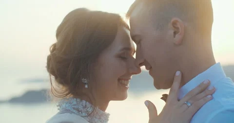 Close up of Romantic wedding couple hugging at sunset light in Montenegro. Stock Footage 137906000