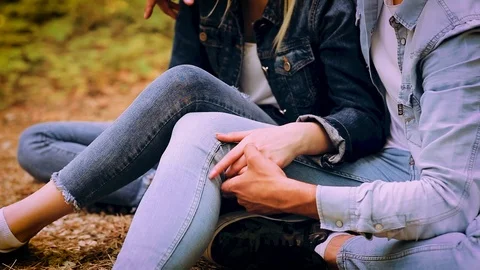 Close Up On Romantic Young Couple Sitting Together In Forest And Enjoying Stock Footage 89892673