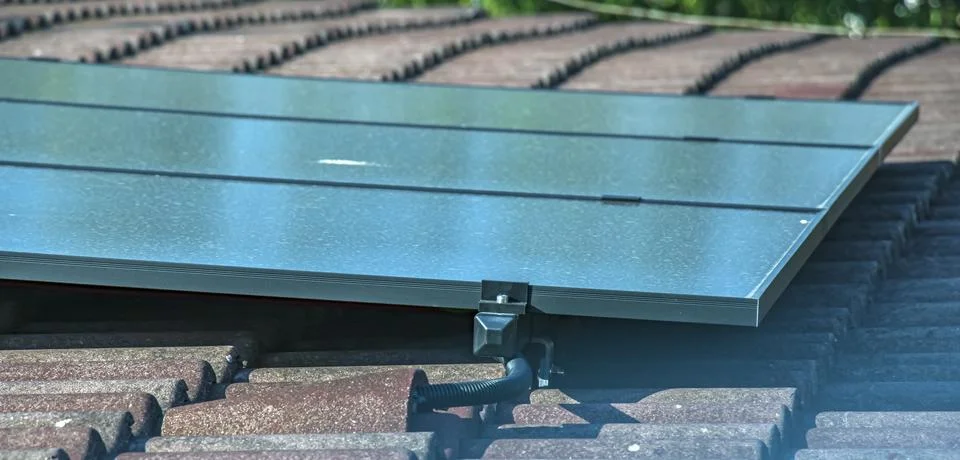 Close-Up of Rooftop Solar Panel Mounting Hardware and Frame Stock Photos