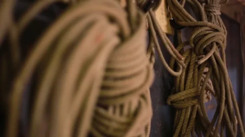 Close-up of rope bundles hanging on the wall Stock Footage 247379329