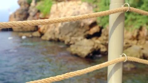 Close Up Rope Railing Beside Rocky Antalya Coast Vidéo 344412711