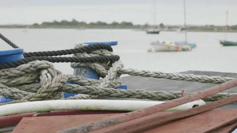 Close up of ropes on the deck of a boat moored in a harbour. 4K locked tripod Stock Footage 164650473