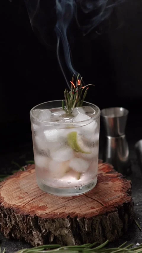 Close-up of rosemary being set on fire. The process of preparing a cocktail and Stock Footage 279915596