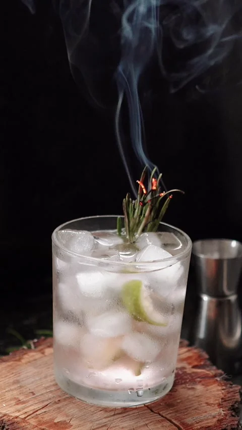 Close-up of rosemary being set on fire. The process of preparing a cocktail and Stock Footage 279915627