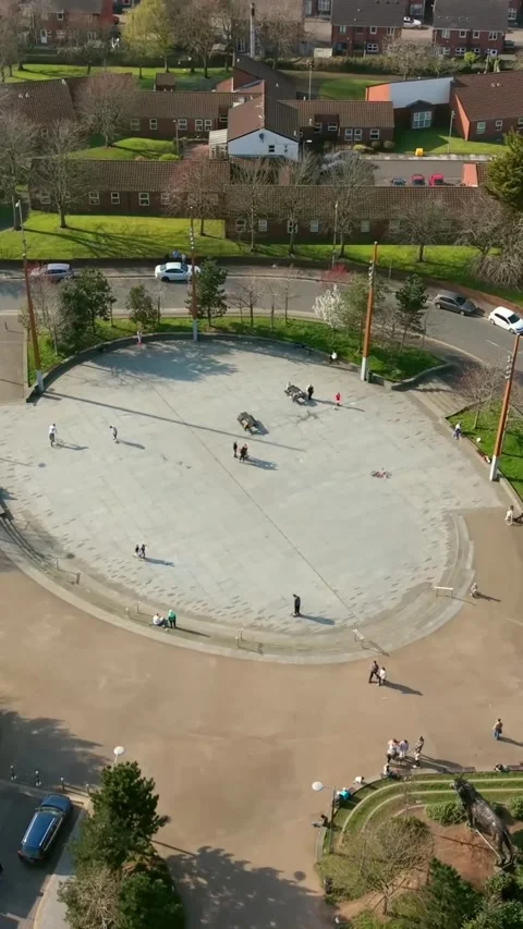 Close rotating 60FPS vertical social ratio aerial video of C.S. Lewis Square in Stock Footage 332891102