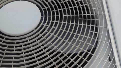 Close Up of Rotating Air Conditioner Outdoor Unit Fan High Angle Stock Footage 329970620