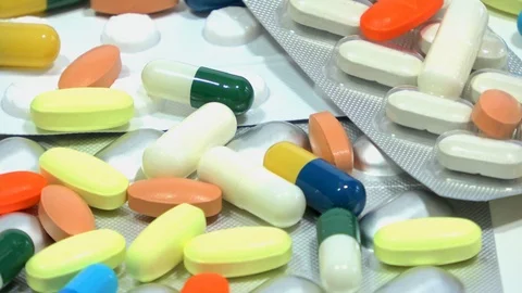 Close up of rotating assorted pharmaceutical medicine pills, tablets and caps Stock Footage 116651823