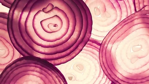 A close-up of rotating, backlit red onion rings. Stock Footage 317508202