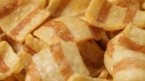 Close up of rotating bacon chips 스톡 동영상 89799383
